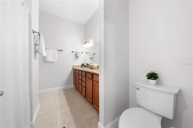 a view of a livingroom with workspace and a couch
