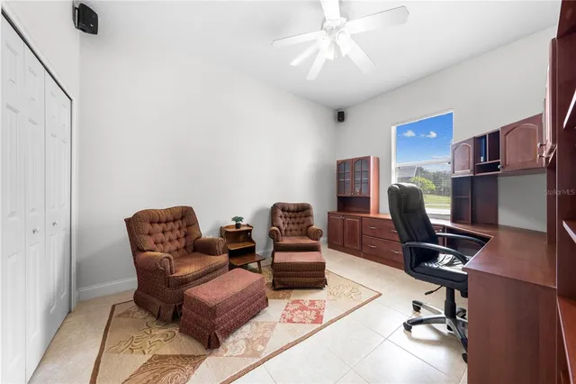 a large bathroom with a granite countertop double vanity sink a mirror and a bathtub