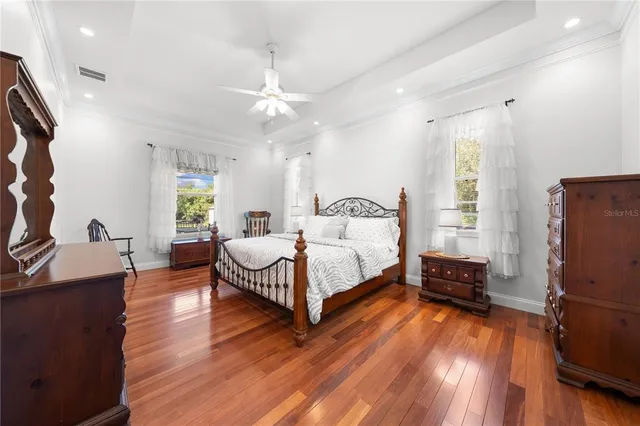 a view of a patio with a table chairs and a swimming pool