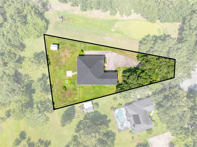 a view of work space with furniture and windows