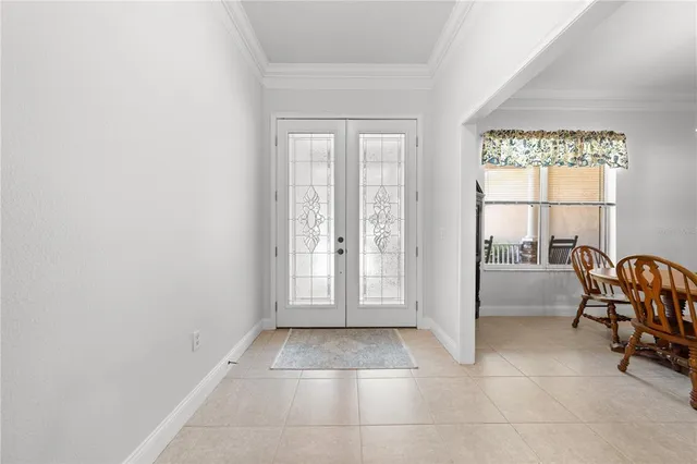 a living room with stainless steel appliances kitchen island granite countertop lots of counter top space and furniture