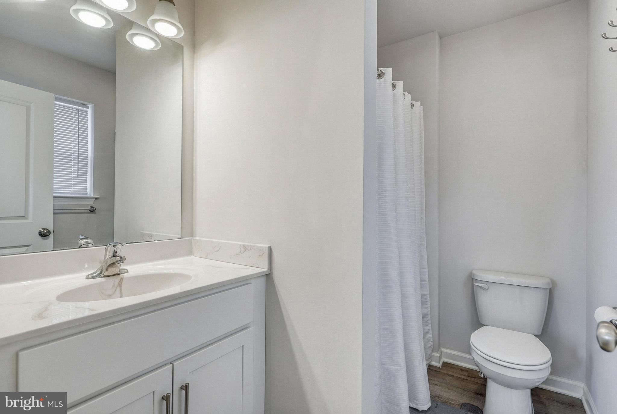 1 Landing Place, Unit 1 York, PA 17408 - Photo 33 of 48 a bathroom with a sink toilet and vanity
