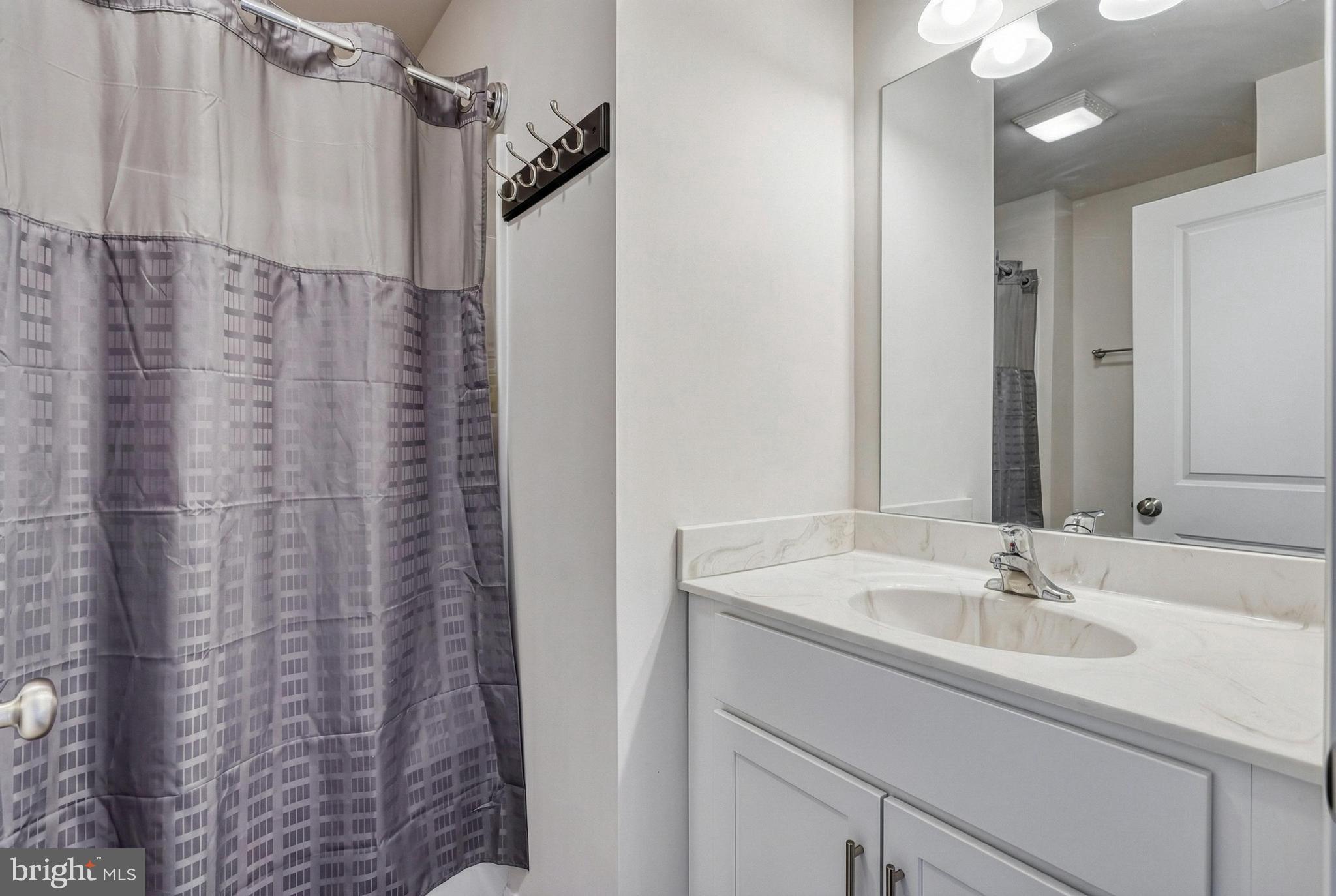 1 Landing Place, Unit 1 York, PA 17408 - Photo 40 of 48 a bathroom with a sink and a mirror