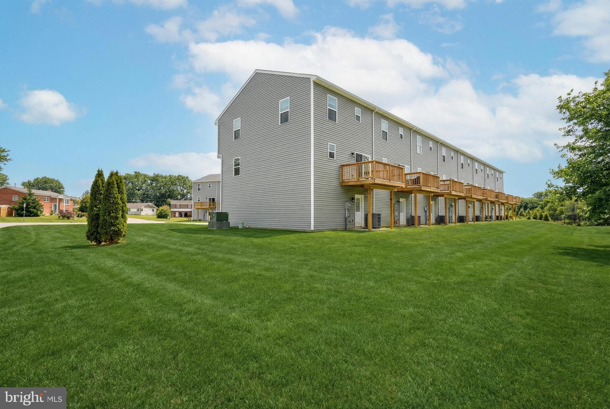 1 Landing Place, Unit 1 York, PA 17408 - Photo 46 of 48 a view of a big building with big yard and large trees