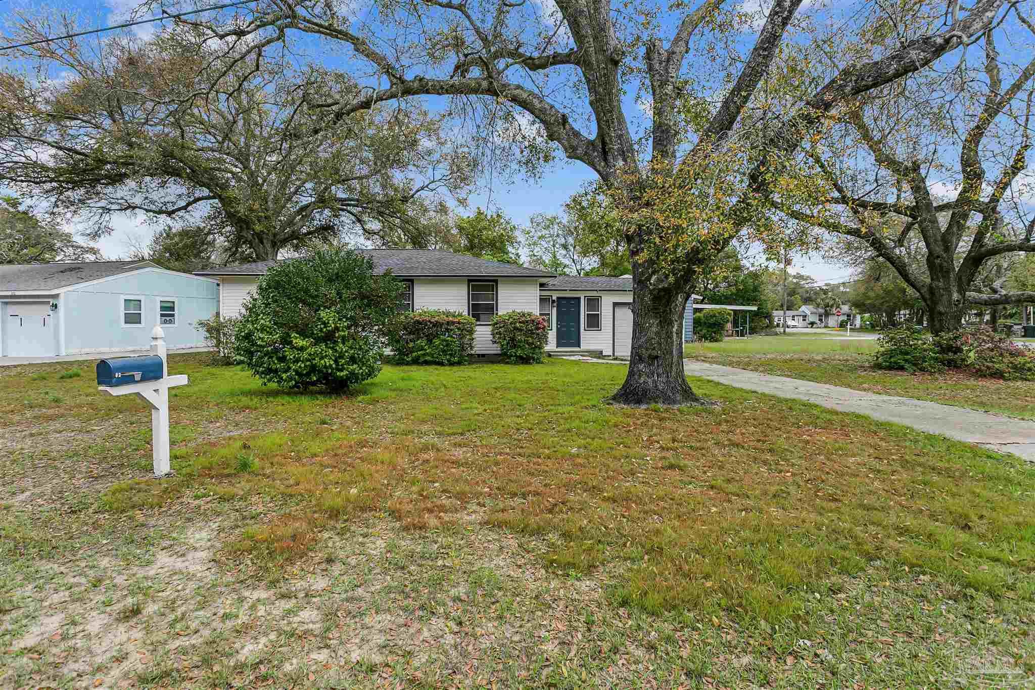 100 Milton Road Pensacola, FL 32507 - Photo 2 of 28 a view of a house with backyard and tree s