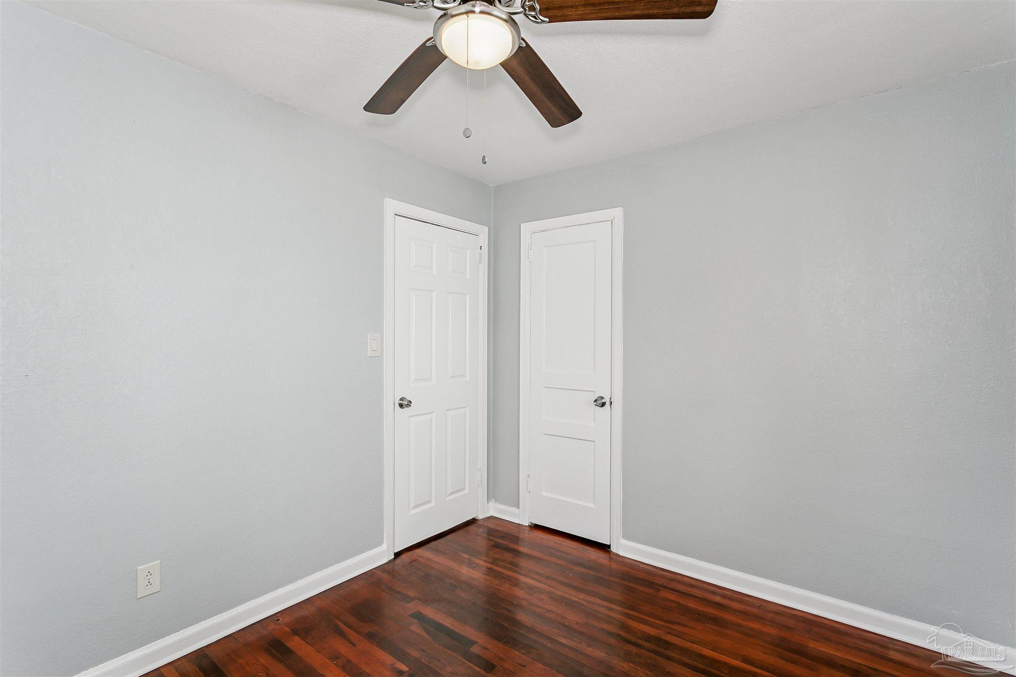 100 Milton Road Pensacola, FL 32507 - Photo 21 of 28 a view of an empty room with wooden floor