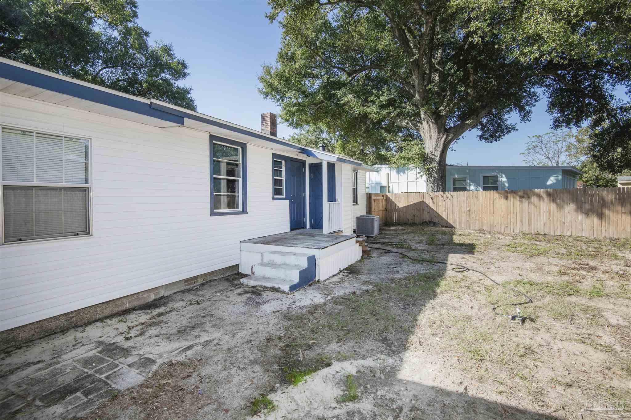 100 Milton Road Pensacola, FL 32507 - Photo 28 of 28 a front view of a house with a yard