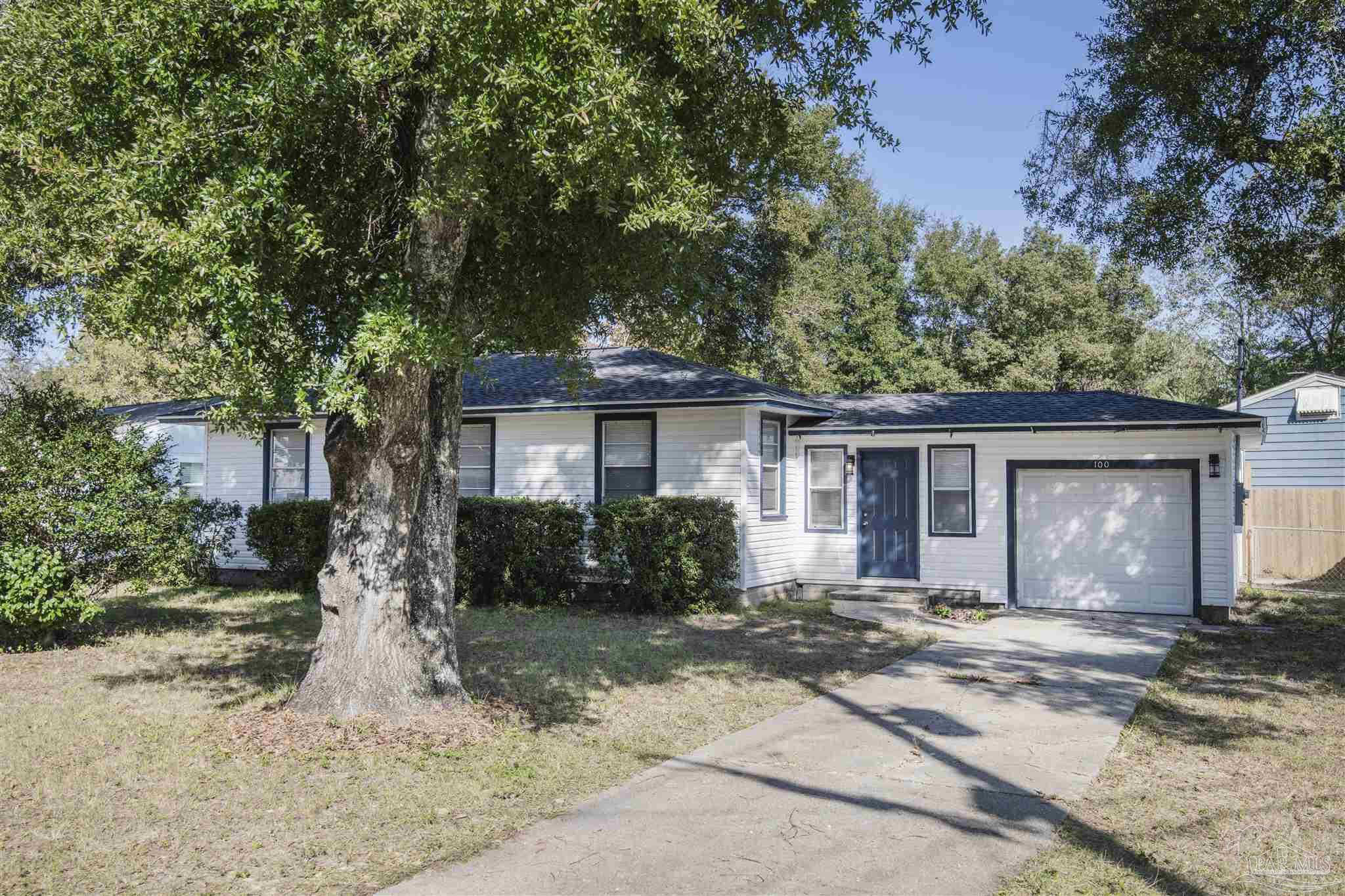 100 Milton Road Pensacola, FL 32507 - Photo 3 of 28 front view of a house with a yard
