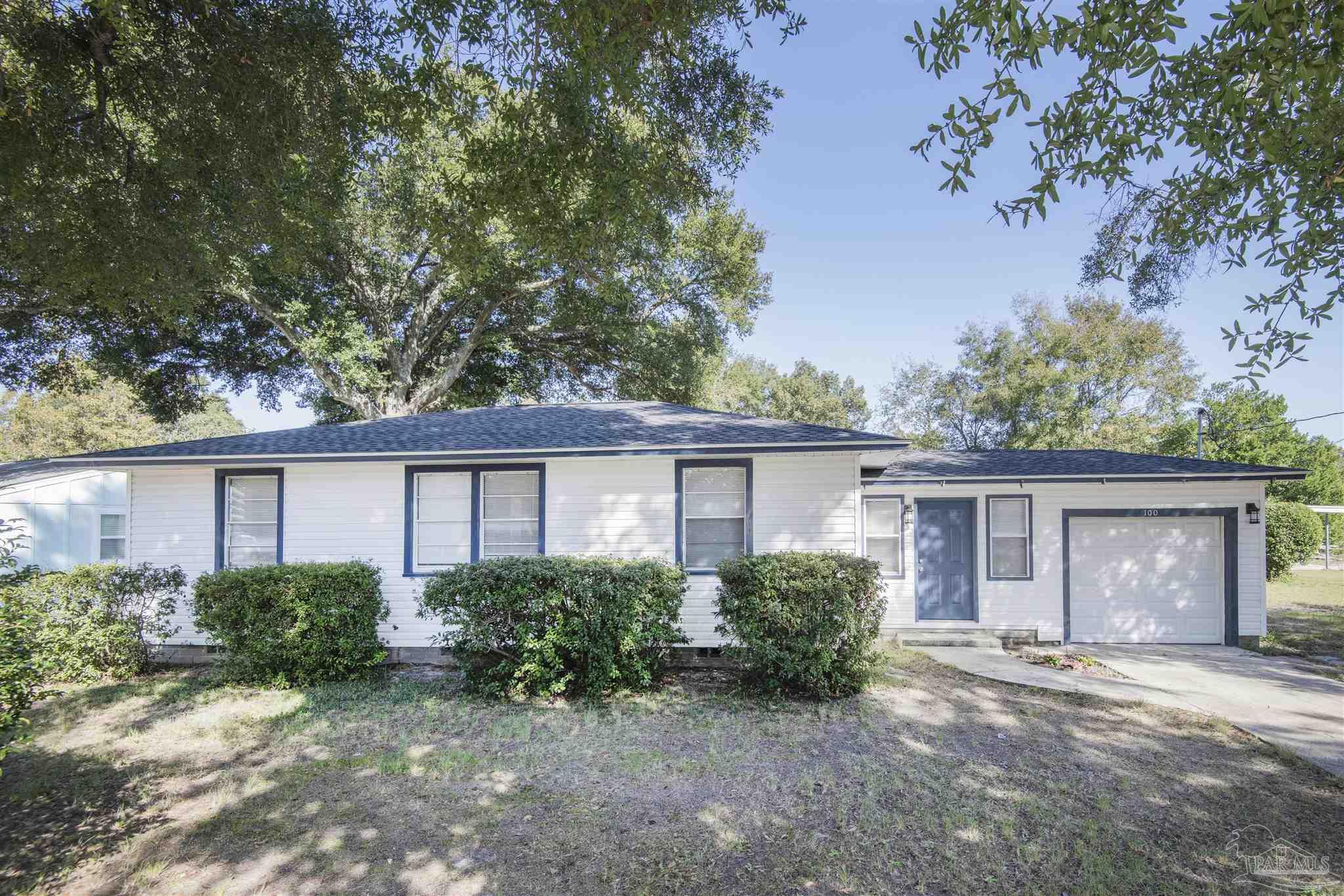 100 Milton Road Pensacola, FL 32507 - Photo 5 of 28 front view of a house with a yard