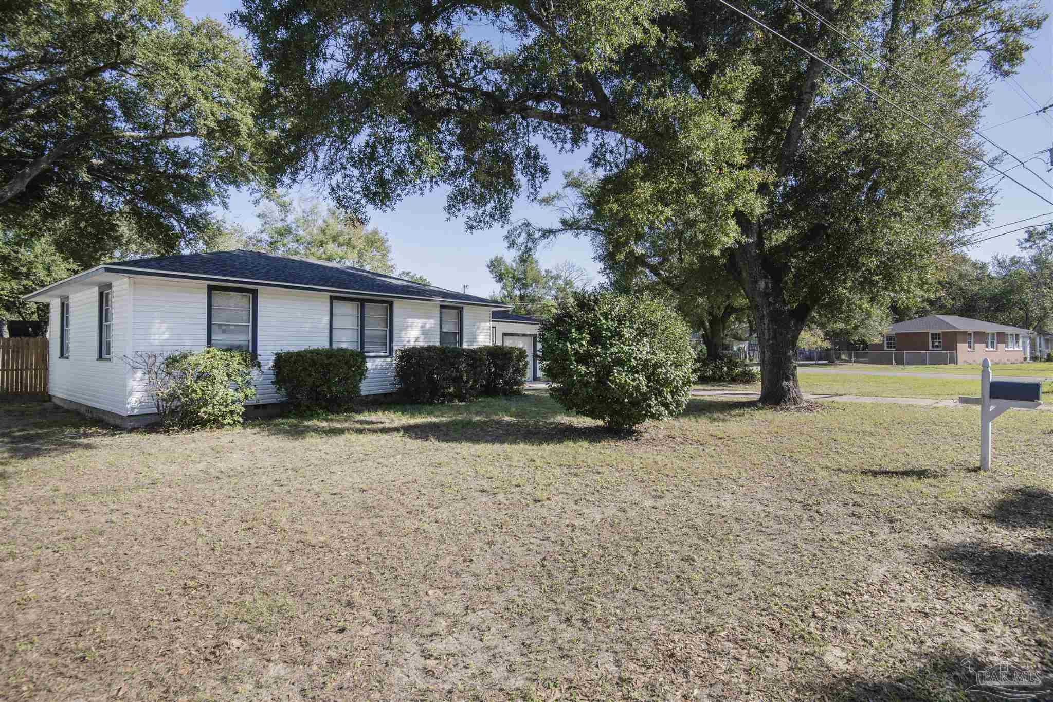 100 Milton Road Pensacola, FL 32507 - Photo 7 of 28 a front view of a house with garden