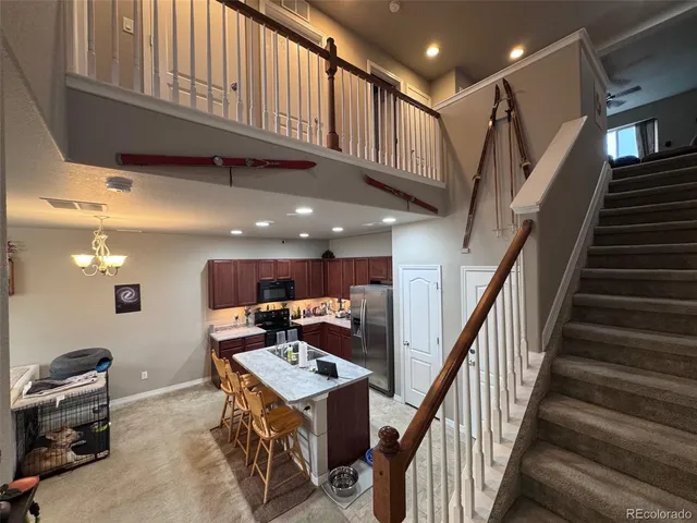 a view of kitchen with furniture and a kitchen