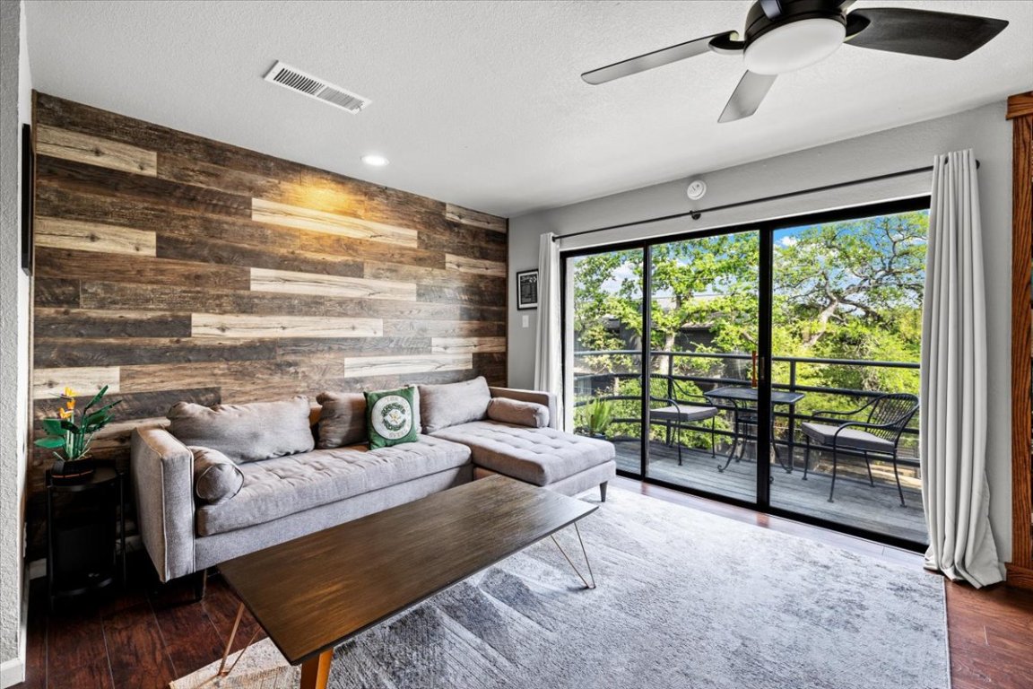 2605 Enfield Road, Unit 209 Austin, TX 78703 - Photo 11 of 29 a living room with furniture and a large window