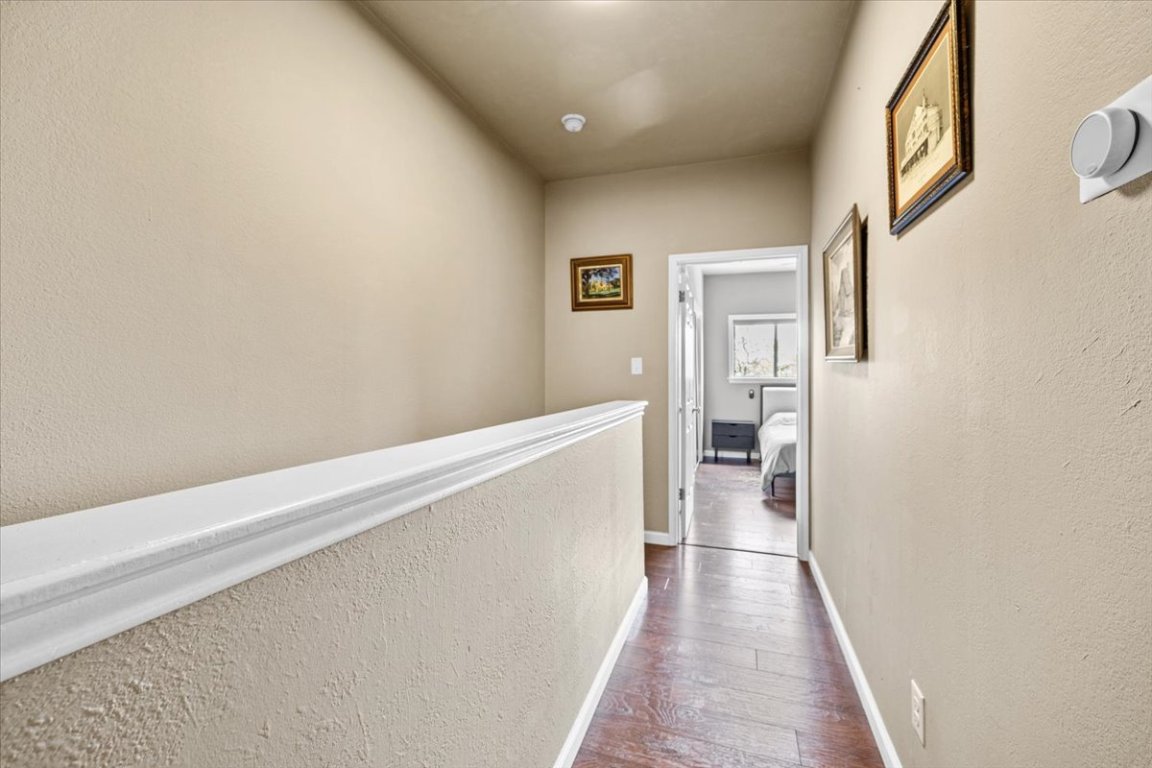 2605 Enfield Road, Unit 209 Austin, TX 78703 - Photo 19 of 29 a view of a hallway with wooden floor