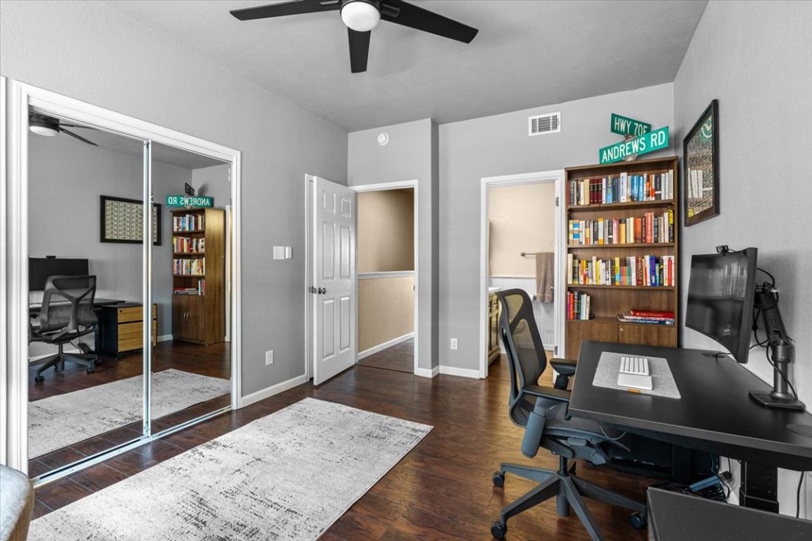 2605 Enfield Road, Unit 209 Austin, TX 78703 - Photo 22 of 29 a view of a workspace with furniture and a window