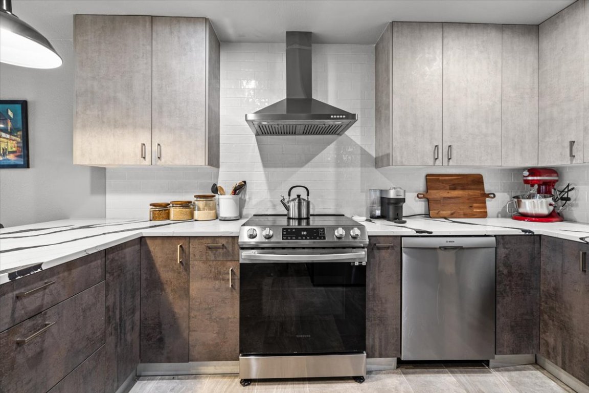 2605 Enfield Road, Unit 209 Austin, TX 78703 - Photo 4 of 29 a kitchen with stainless steel appliances a sink stove and cabinets