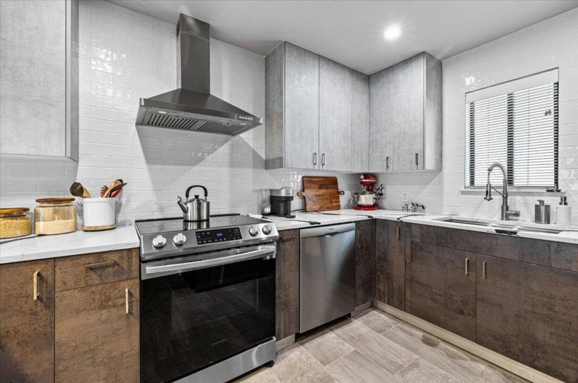 2605 Enfield Road, Unit 209 Austin, TX 78703 - Photo 5 of 29 a kitchen with stainless steel appliances a sink stove and cabinets