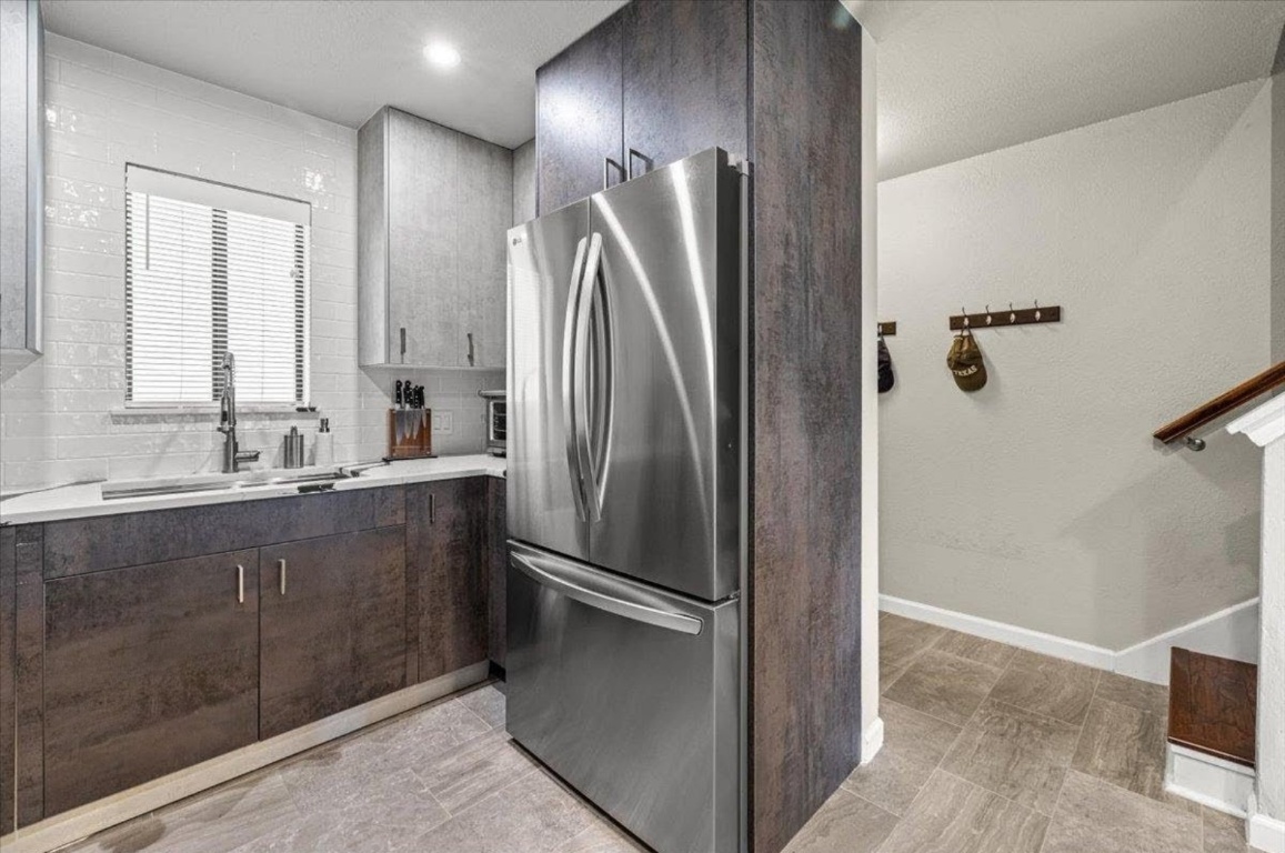 2605 Enfield Road, Unit 209 Austin, TX 78703 - Photo 6 of 29 a bathroom with a double vanity sink and mirror