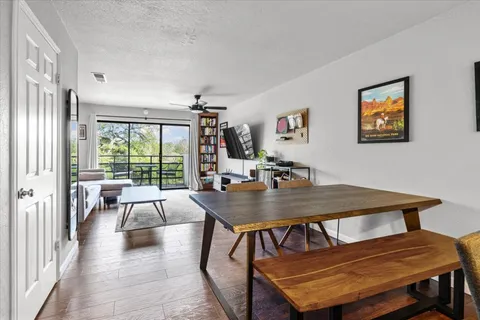 a view of a dining room with furniture window and outside view