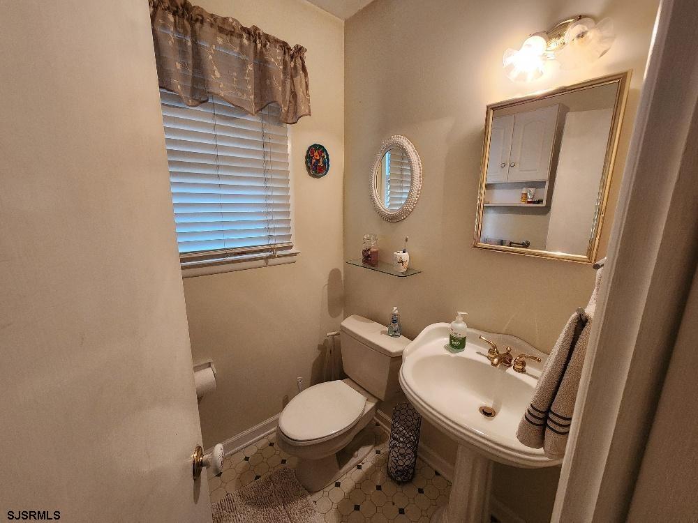 63 Cranford Road Turnersville, NJ 08012 - Photo 13 of 35 a bathroom with a toilet sink and mirror