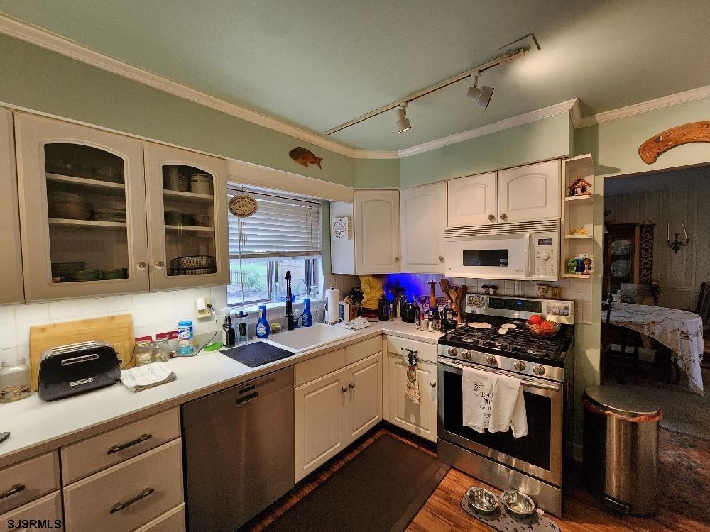 63 Cranford Road Turnersville, NJ 08012 - Photo 17 of 35 a kitchen with stainless steel appliances a stove sink microwave and cabinets
