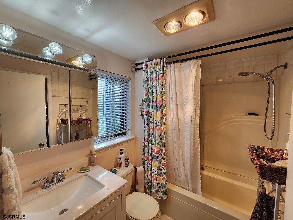 63 Cranford Road Turnersville, NJ 08012 - Photo 33 of 35 a bathroom with a sink vanity granite tub shower and a mirror