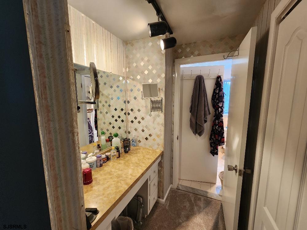 63 Cranford Road Turnersville, NJ 08012 - Photo 34 of 35 a bathroom with a granite countertop sink a toilet and shower