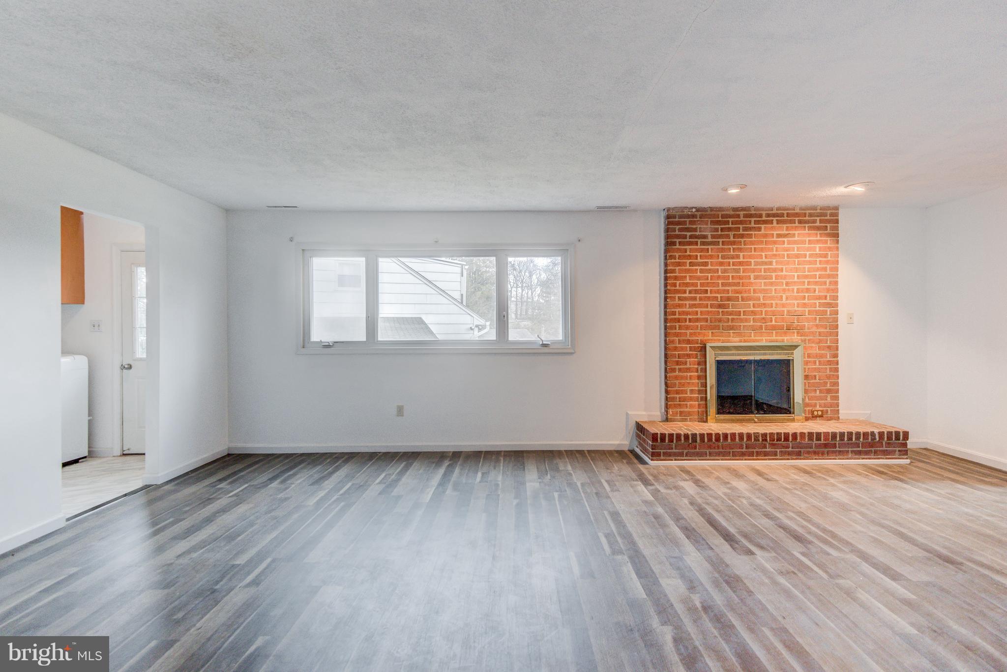 7105 Chamberlain Road Windsor Mill, MD 21244 - Photo 12 of 38 HUGE FAMILY ROOM with Masonry wood burning FP