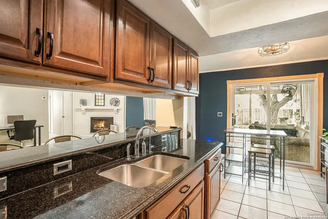 a kitchen with stainless steel appliances granite countertop a sink and cabinets