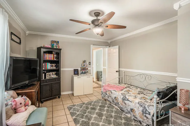 a bedroom with a bed and flat screen tv