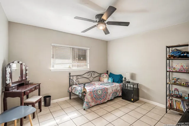 a bedroom with furniture and a window