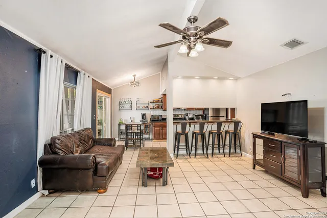a living room with furniture and flat screen tv