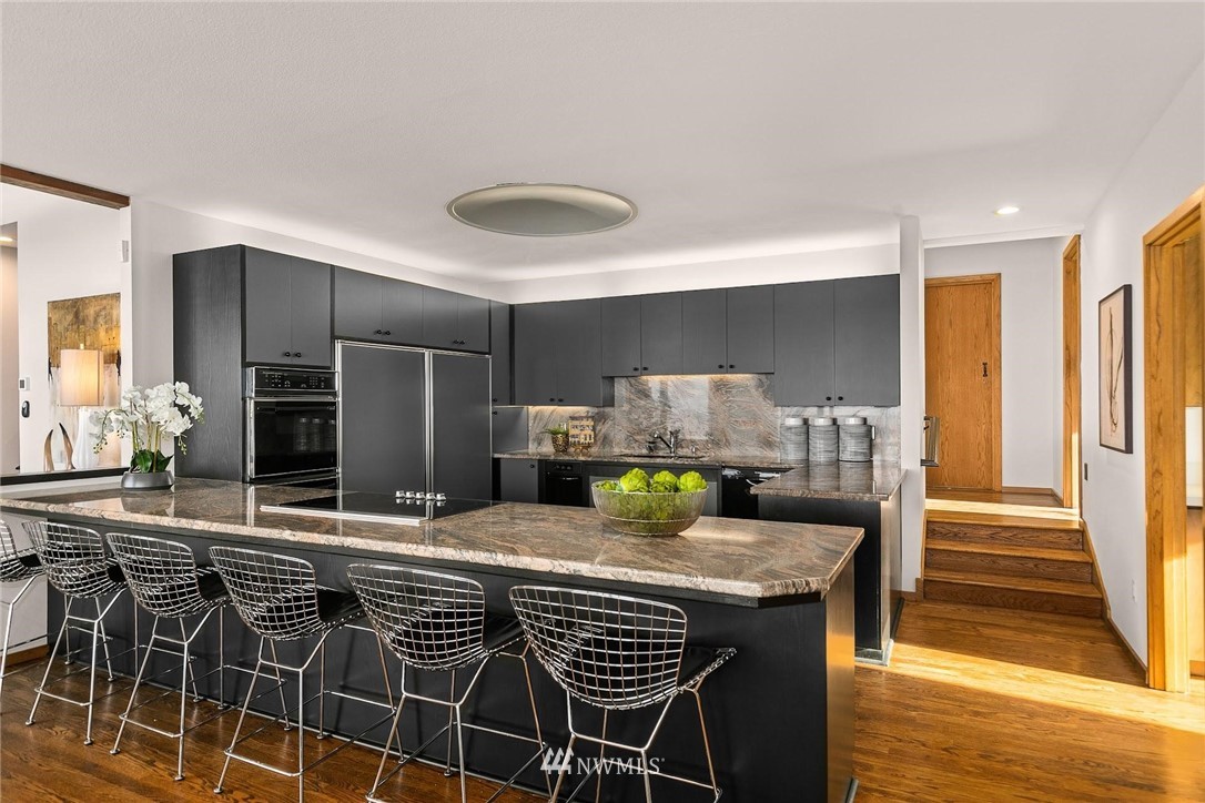 16900 Talbot Road Edmonds, WA 98026 - Photo 13 of 40 a kitchen with a table and chairs in it