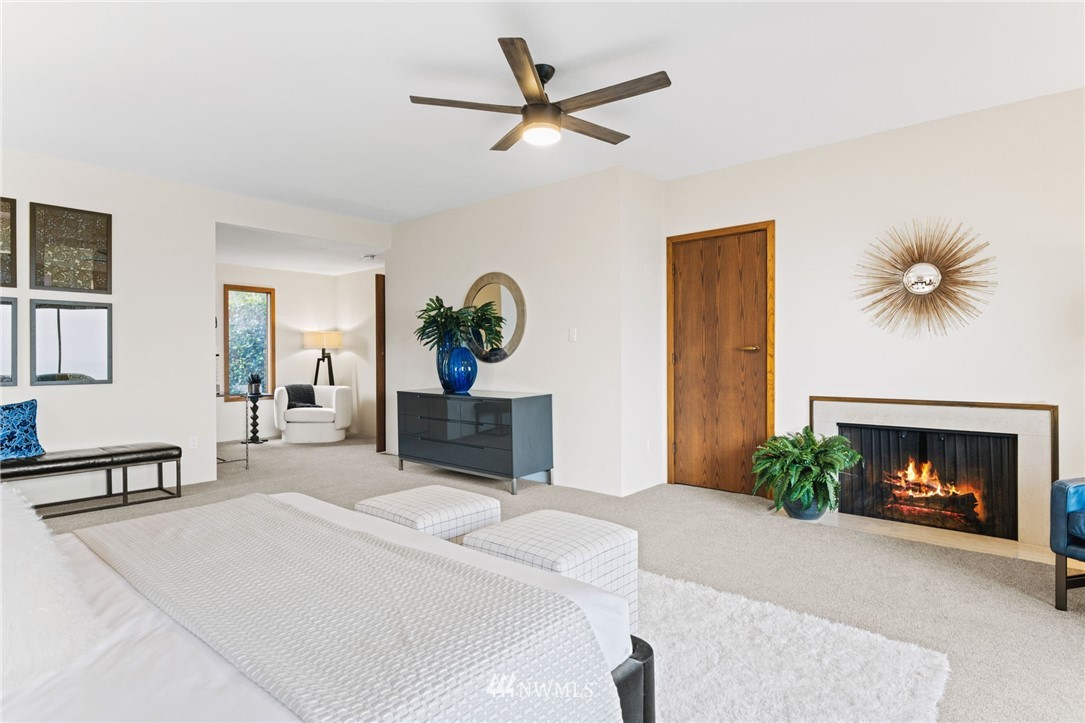 16900 Talbot Road Edmonds, WA 98026 - Photo 22 of 40 a bedroom with furniture and a fireplace