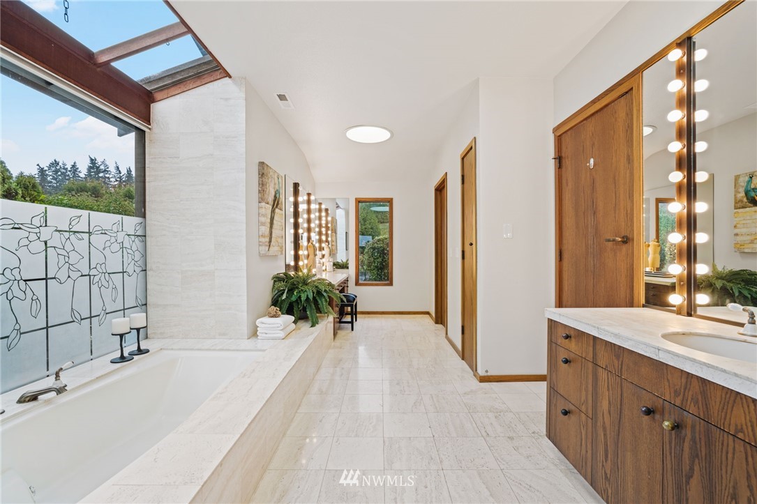 16900 Talbot Road Edmonds, WA 98026 - Photo 24 of 40 a spacious bathroom with a double vanity sink and a large mirror