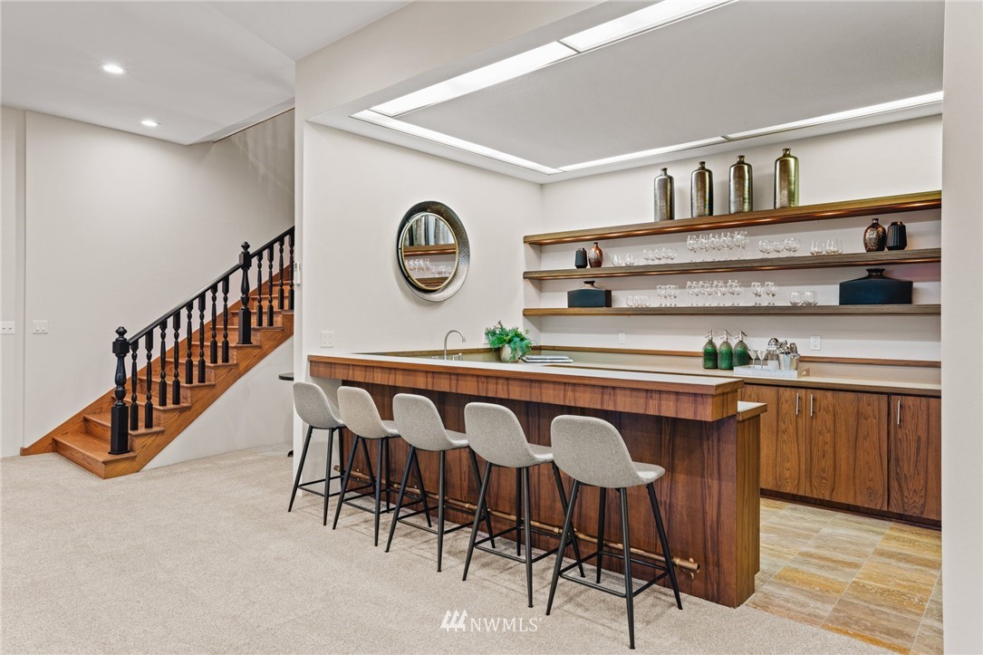 16900 Talbot Road Edmonds, WA 98026 - Photo 26 of 40 a view of a kitchen with a table and a clock