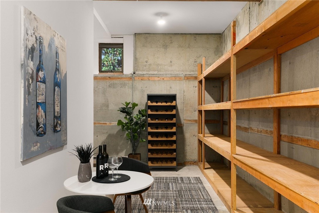 16900 Talbot Road Edmonds, WA 98026 - Photo 32 of 40 a kitchen with a refrigerator and cabinets