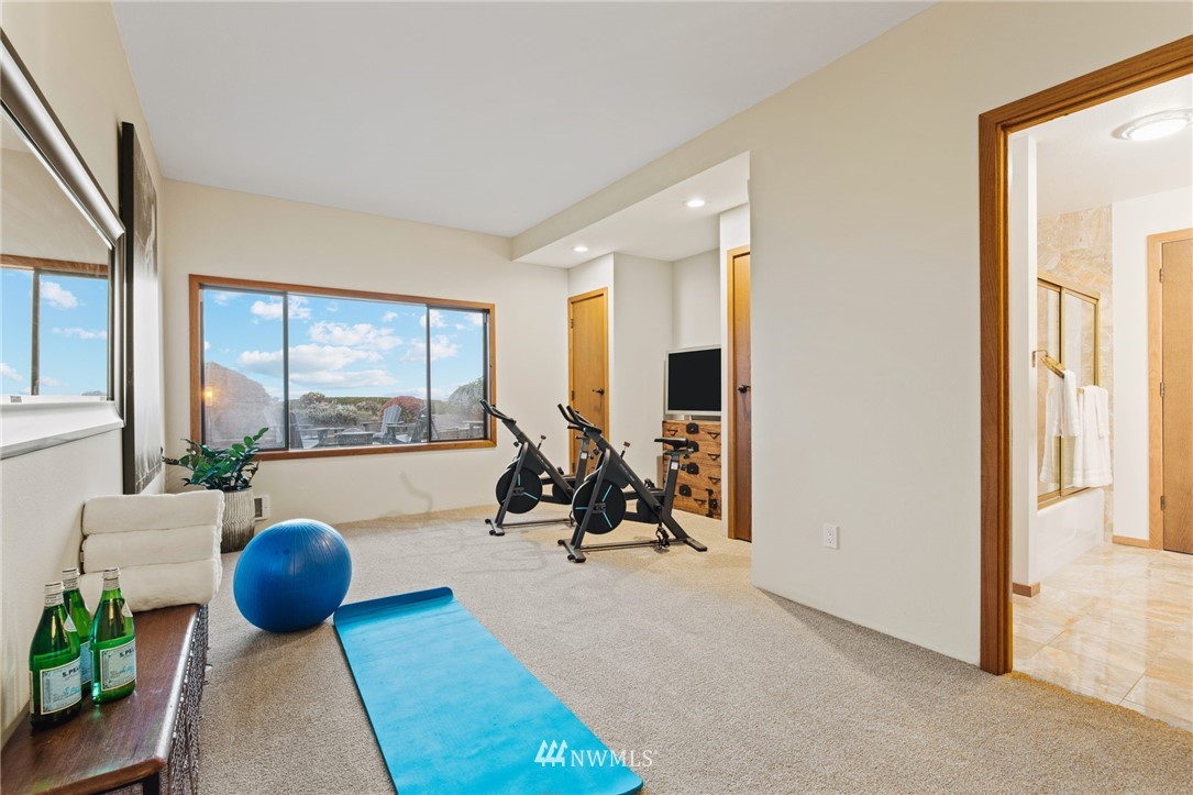 16900 Talbot Road Edmonds, WA 98026 - Photo 38 of 40 a living room with furniture and a floor to ceiling window