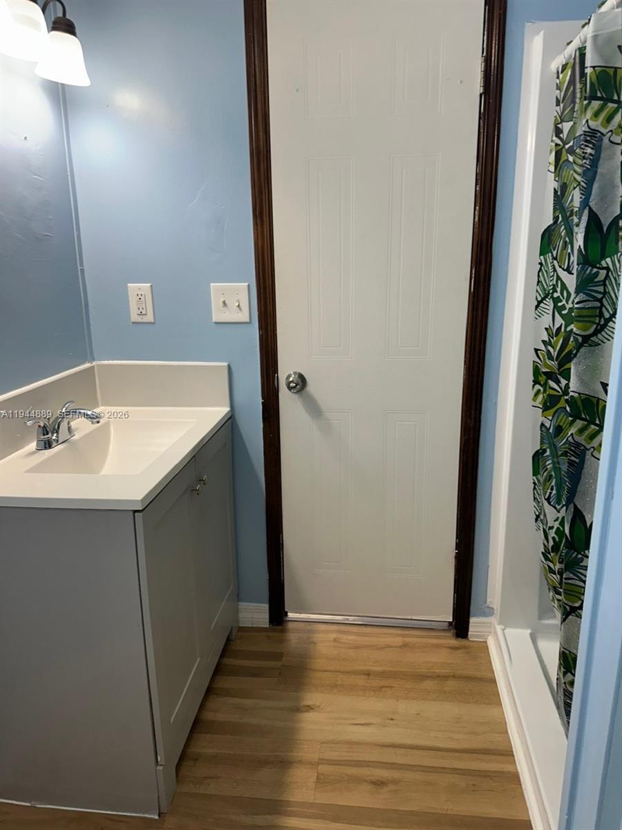 1122 Johnson Road Clewiston, FL 33440 - Photo 12 of 26 a bathroom with a sink and a mirror