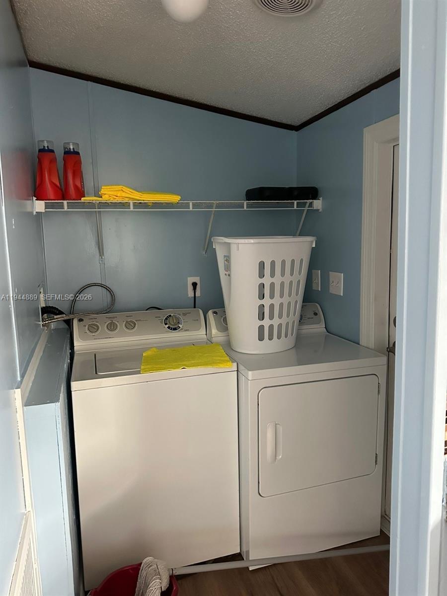 1122 Johnson Road Clewiston, FL 33440 - Photo 17 of 26 a utility room with dryer and washer