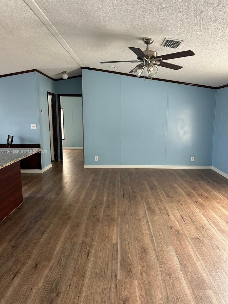 1122 Johnson Road Clewiston, FL 33440 - Photo 7 of 26 a view of a room with wooden floor and staircase