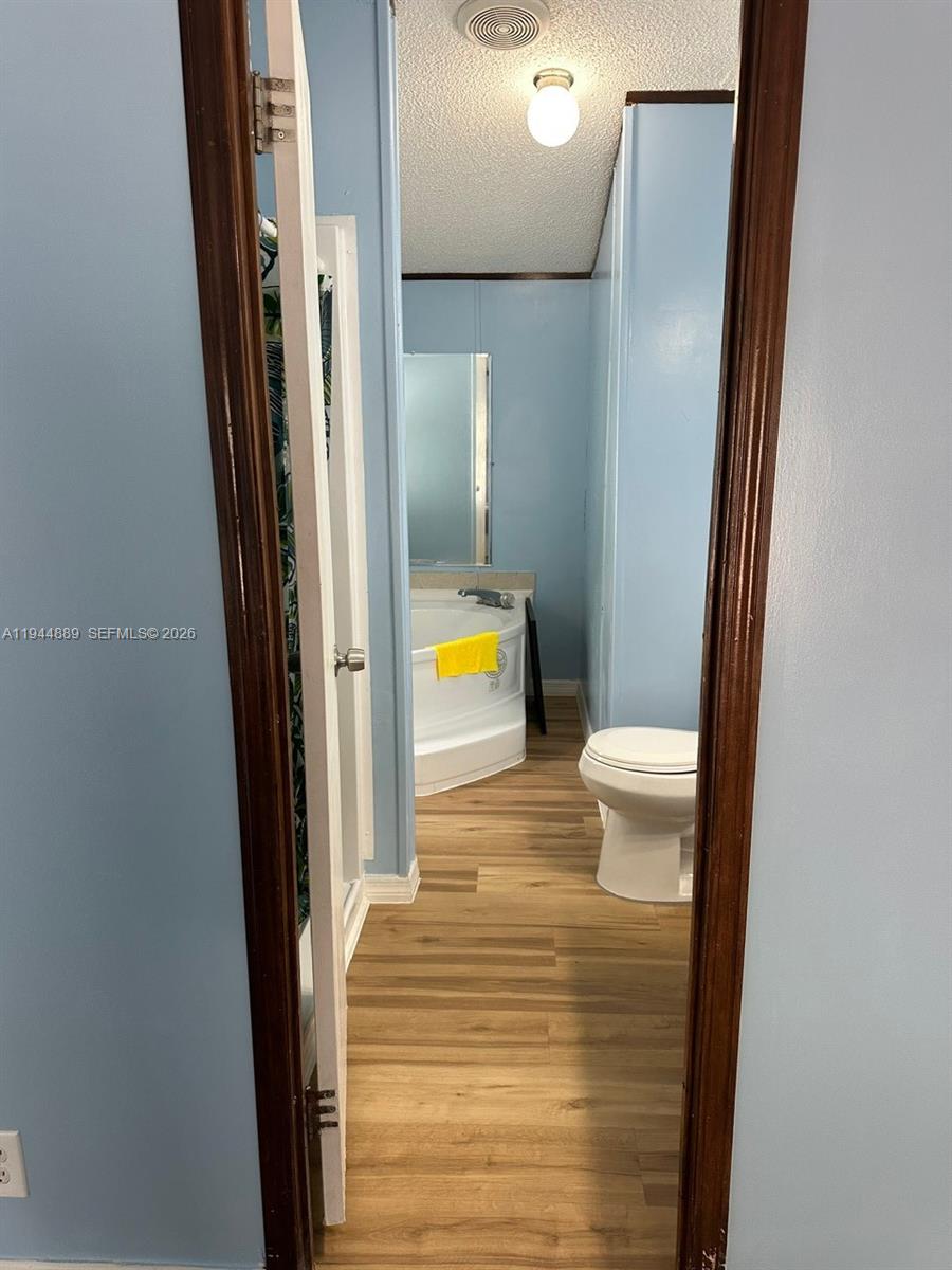 1122 Johnson Road Clewiston, FL 33440 - Photo 9 of 26 a bathroom with a sink and a toilet