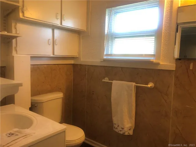 a bathroom with a toilet and a sink