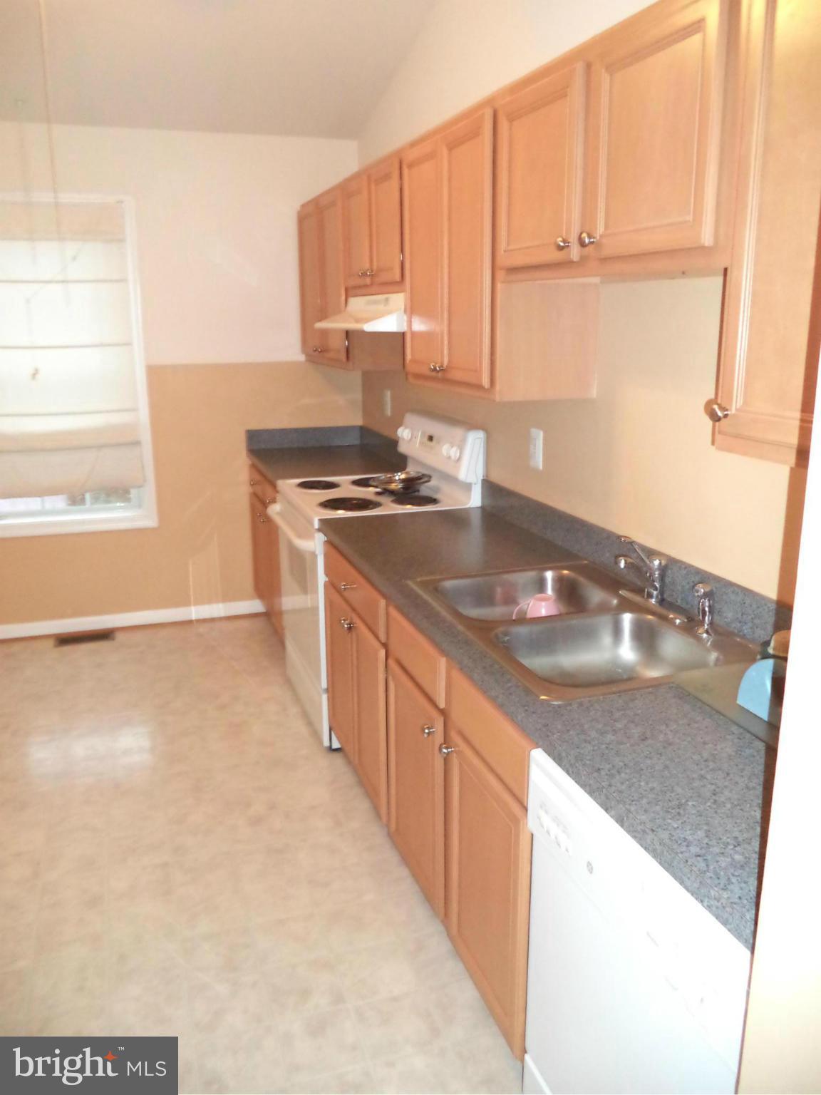 80 Ford Inwood Wv 25428 Inwood, WV 25428 - Photo 13 of 24 a kitchen with stainless steel appliances granite countertop a sink stove and refrigerator