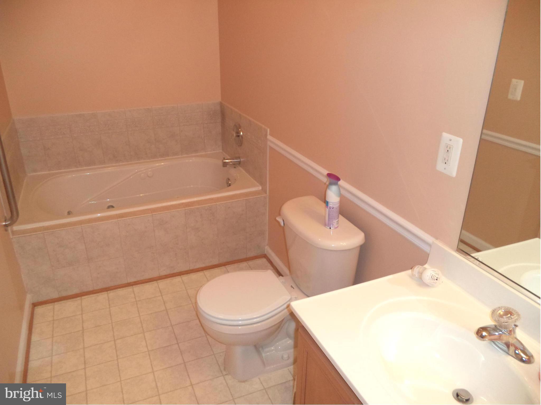 80 Ford Inwood Wv 25428 Inwood, WV 25428 - Photo 3 of 24 a white toilet sitting next to a bathroom sink and vanity