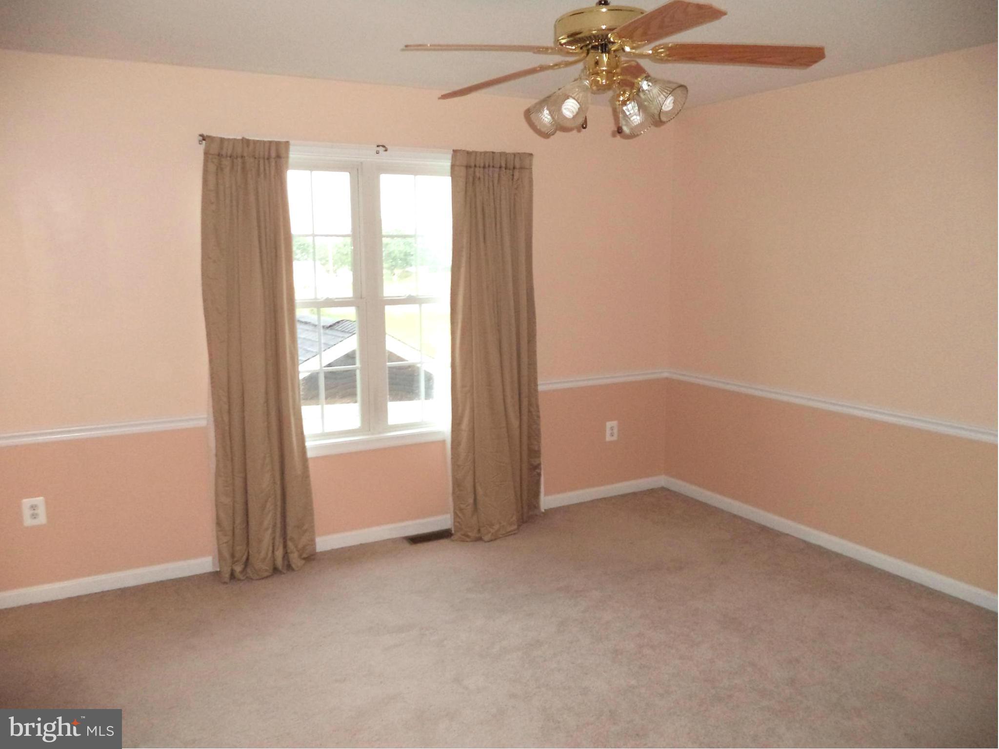 80 Ford Inwood Wv 25428 Inwood, WV 25428 - Photo 5 of 24 an empty room with windows and fan