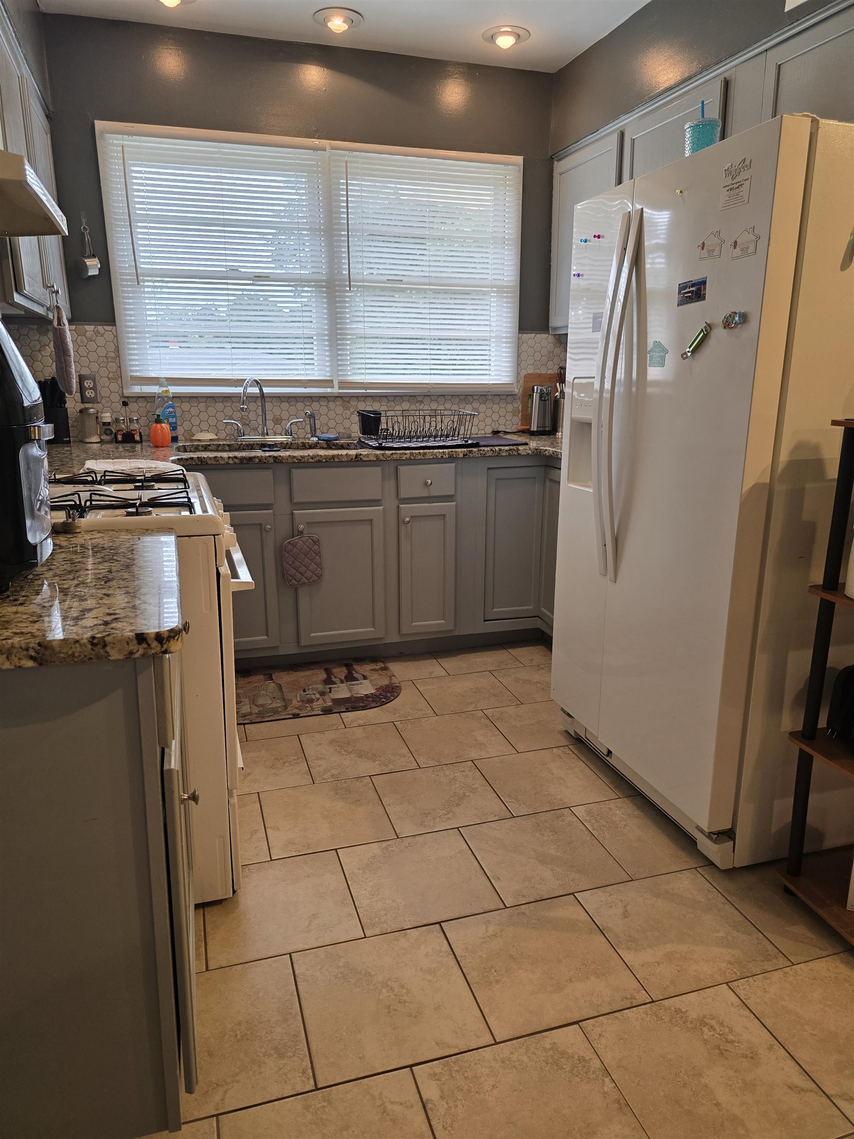 1400 Randall Drive Memphis, TN 38116 - Photo 8 of 23 a kitchen with a sink a refrigerator and counter top