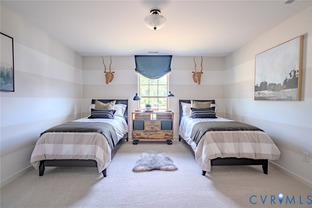 15790 Mosaic Creek Boulevard, Unit 231 Richmond, VA 23238 - Photo 22 of 25 a bedroom with two beds and a large window