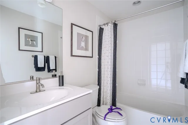 a bathroom with a granite countertop sink a shower and a mirror