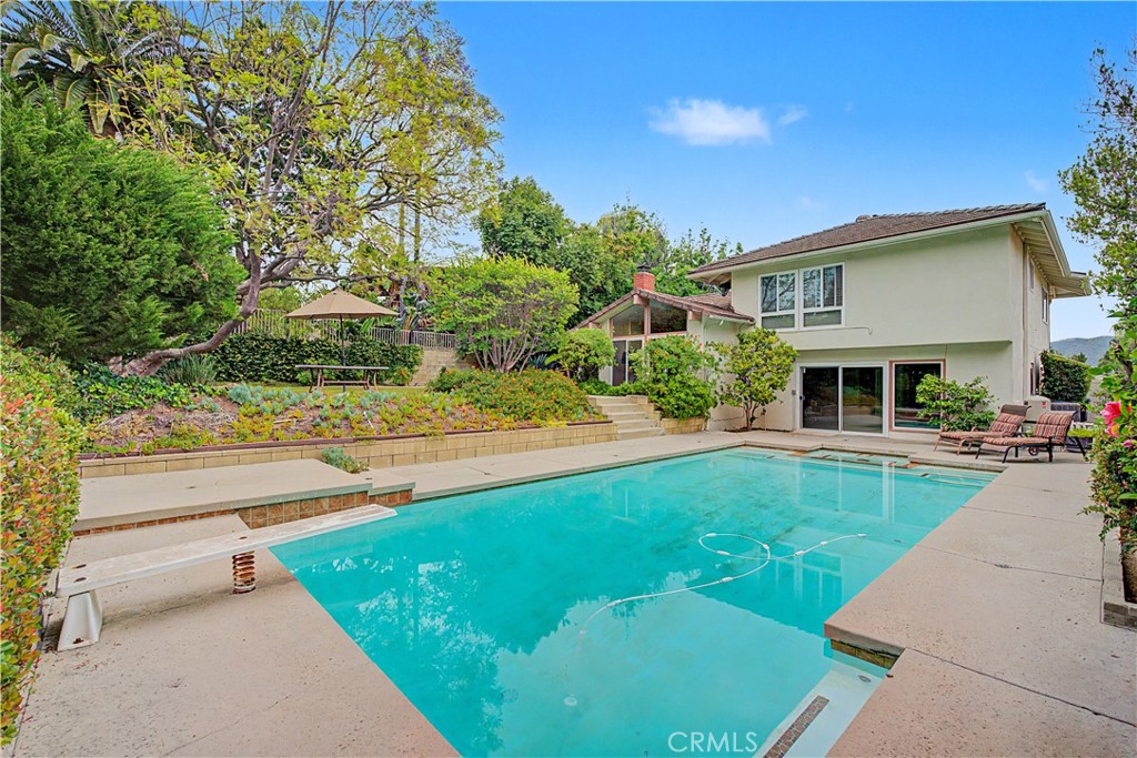 22671 Town Crier Road Calabasas, CA 91302 - Photo 10 of 35 a front view of a house with garden