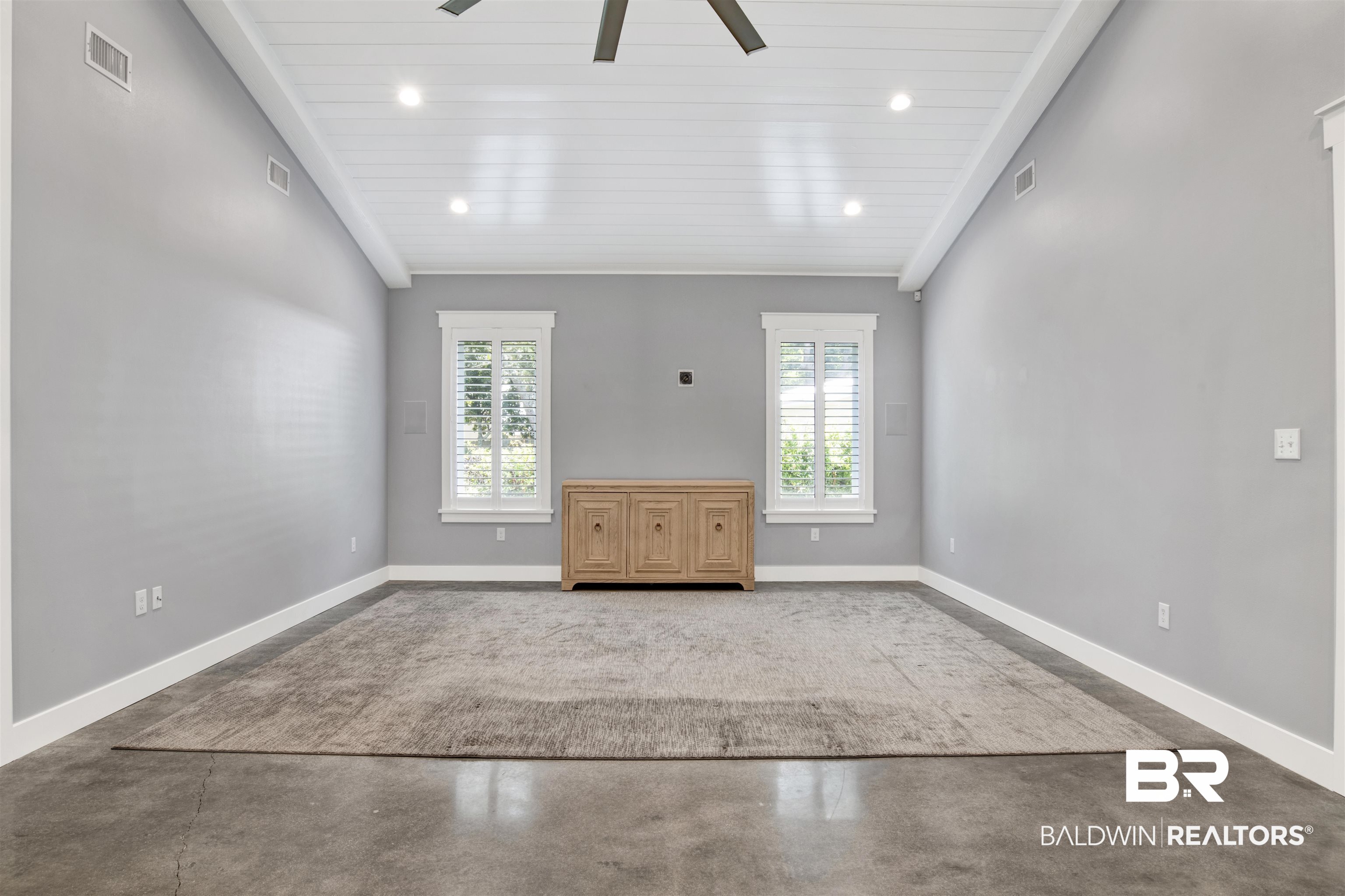 27980 Canal Road Orange Beach, AL 36561 - Photo 38 of 46 Unfurnished living room featuring recessed lighting, concrete flooring, lofted ceiling, wooden ceiling, and a ceiling fan